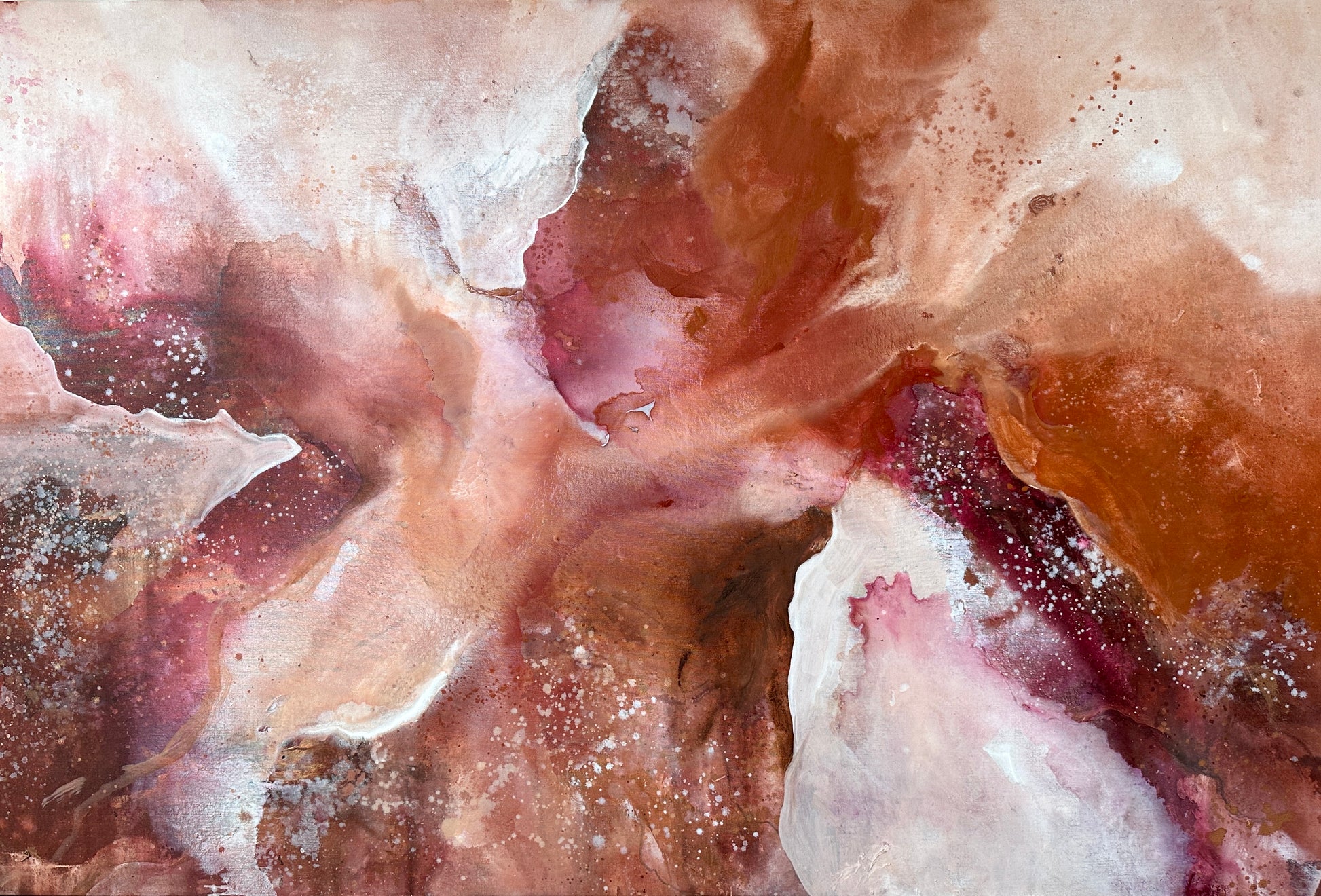 Close-up of a textured surface with pink and brown colors