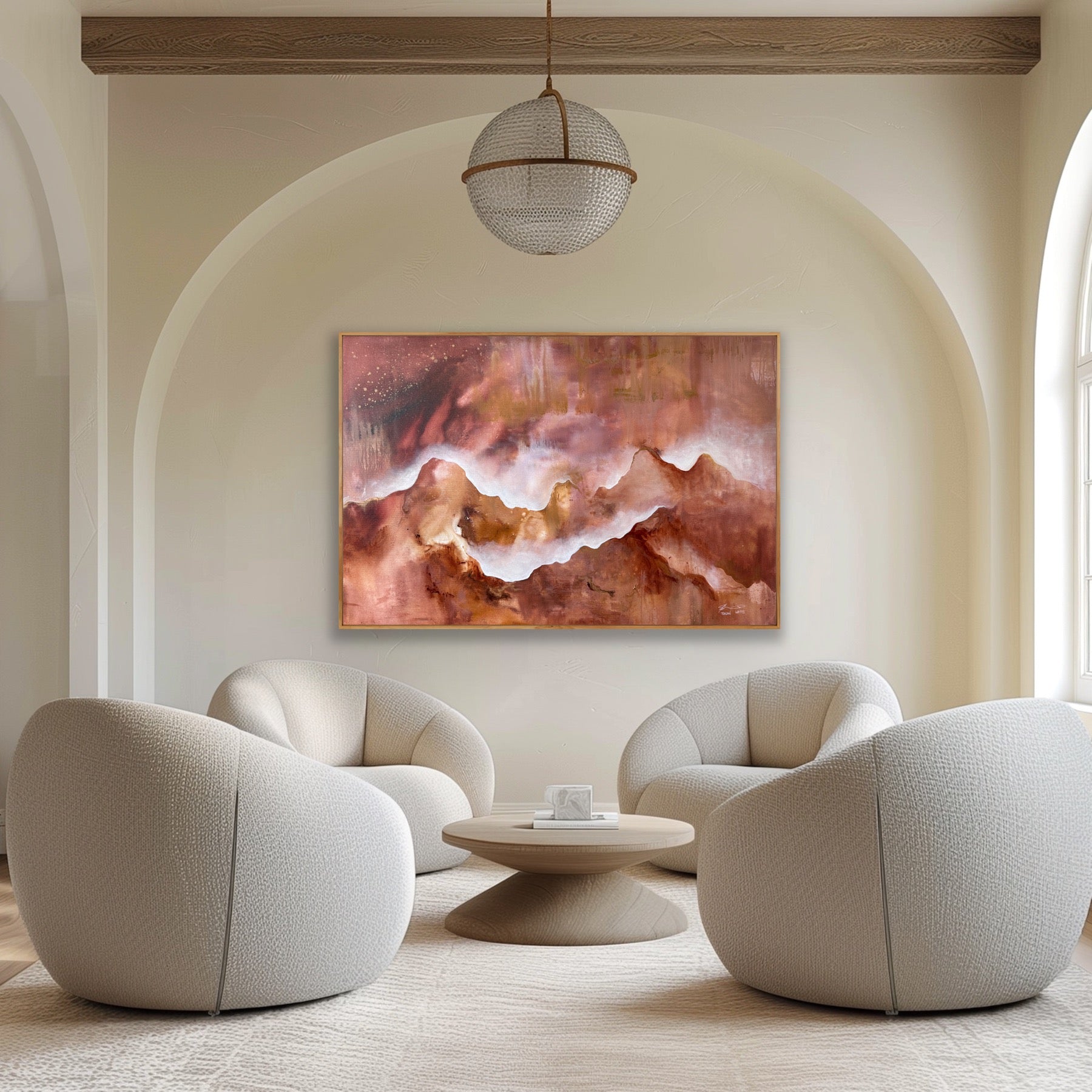 Modern living room with beige armchairs, a round coffee table, and a colorful abstract painting on the wall.